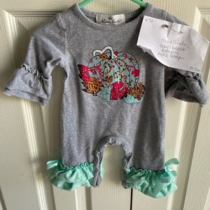 Marie Nicole 0-3m GUC pumpkin ruffle romper